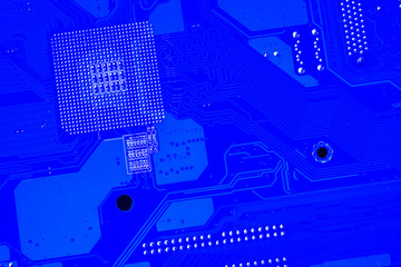 Computer motherboard. Tracks on the printed circuit board. Electronic components. Resistor,...