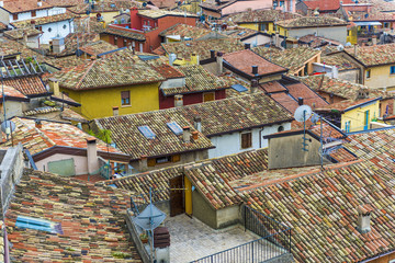 A view of the roof tops of Malcesine sitting on the edge of the beautiful lake Garda in Italy, Europe