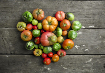 tomatoes, red, yellow , orange, green, healthy food, wooden background.