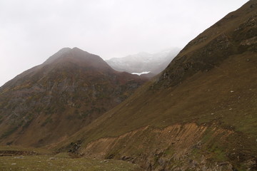 Fototapeta premium The beautiful scene of two mountains with clouds