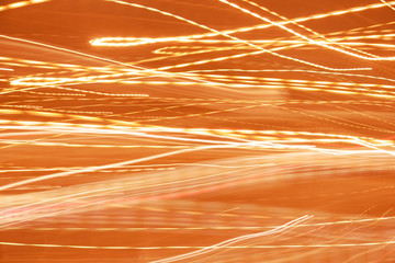 Orange abstraction motion light on speed, lighting background in long exposure