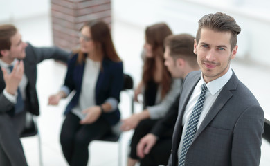 Happy young businessman in a business meeting