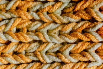 Woman Knitting a scarf. Hands holding threads. Colorfull Knitting