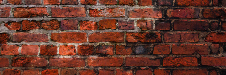 Panoramicz photo of a wall from a red old brick