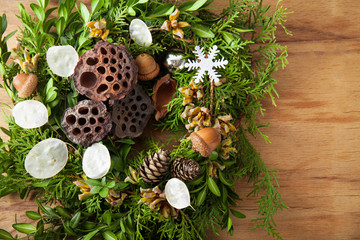 Christmas wreath on wood desk.