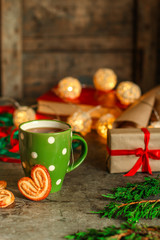 tea - a cup of tea and gifts for the new year. Brewed tea bag. a cup on the table and a festive atmosphere. top view.