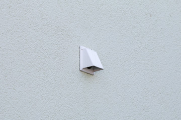 Ventilation cover on a white wall