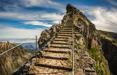 Madeira, Portugal. Steps on a hiking path between Pico do Arieiro and Pico do Ruivo above the clouds.