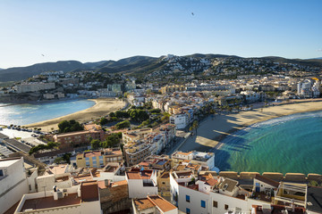 Fototapeta na wymiar Aerial view of Peninsula town with harbour and marina , Costa del Azahar, province of Castellon, Valencian Community. Peniscola is a popular tourist destination in Spain. View from the castle. 
