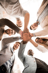Fototapeta premium close up.business team standing in a circle and folded their hands together.