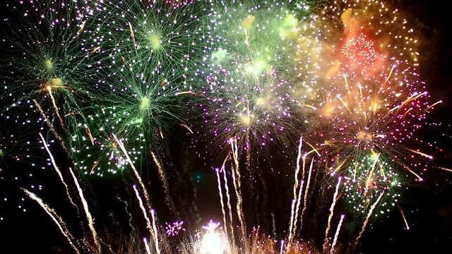 Colorful firework festival on night sky background. New year celebration.