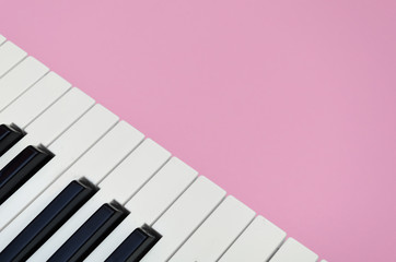 Fototapeta na wymiar Pink music background with a piano in the left corner