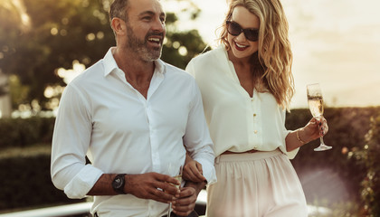 Beautiful couple with a glass of wine outdoors