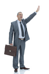confident businessman making a welcoming hand gesture