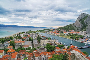 Naklejka na ściany i meble Beautiful summer view on Omis town and Cetina river in Croatia.