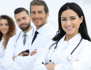 Fototapeta premium woman doctor on the background of colleagues