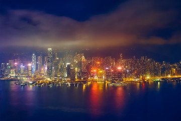 Plakat Aerial view of illuminated Hong Kong skyline. Hong Kong, China