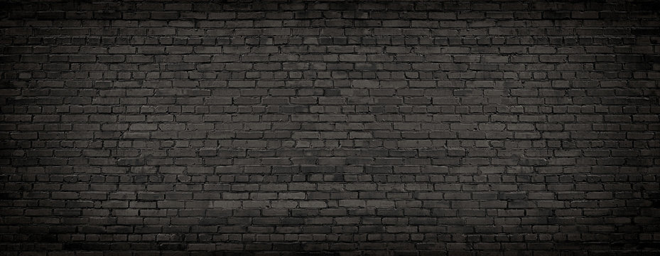 black brick wall, texture of dark brickwork close-up