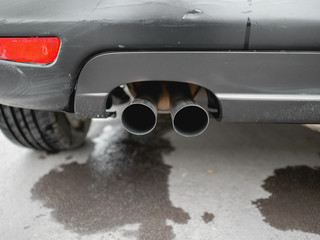 Exhaust pipe of black car