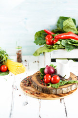 Cherry, tarragon, spaghetti, chili pepper, basil, spices Ingredients for cooking pasta. Food background