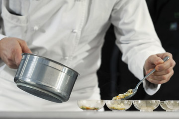 Chef cooking sea food in a restaurant