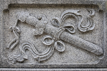 The object carved on the marble is a treasured sword which symbolizes power in Chinese Culture. The figure of a treasured sword can be seen in many Chinese temples granite carvings. 