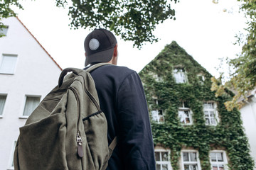 A tourist goes to the guesthouse or hostel in order to stay in a room that he booked or a student with a backpack returns home after his studies at the institute or on vacation.