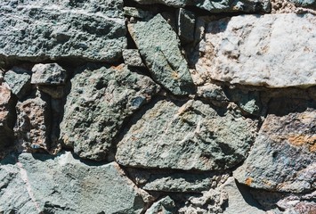 Stone wall bright sunny day