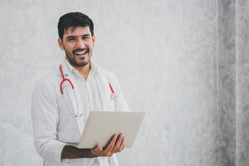 Doctor with laptop and stethoscope