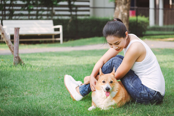 Asian woman with Welsh Corgi Pembroke dog