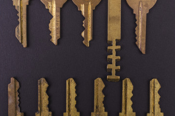 Old vintage keys on black background. Several types of old retro keys. Set of old keys. Composition of different keys. Advertising design.