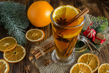 Mulled wine and Christmas composition on the brown wooden  background