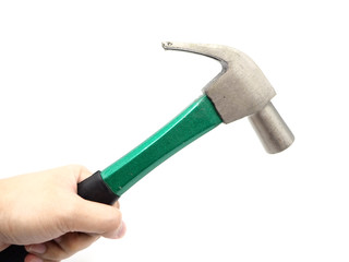 Hand holding a green iron hammer with rubberized handle isolated on a white background.
