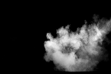 Explosion of white dust on black background.