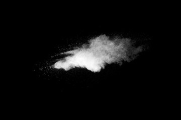 Fototapeta na wymiar Explosion of white dust on black background.