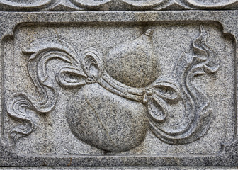 The object of the granite carving is bottle gourd, a good luck symbol in Chinese Culture.