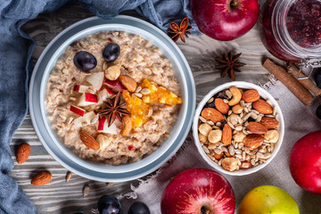oatmeal with fruit and nuts, healthy breakfast, top view