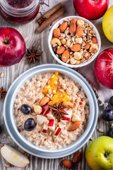 oatmeal with fruit and nuts, healthy breakfast, top view