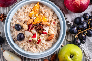 oatmeal with fruit and nuts, healthy breakfast, top view