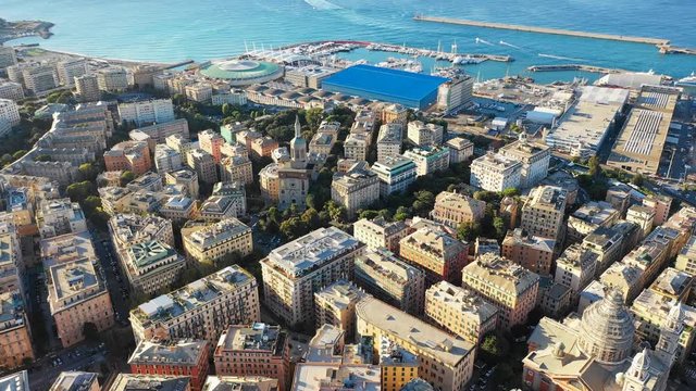 Aerial panoramic view of cityscape of Genoa (Genova), famous port and capital city of Liguria at sunrise - landscape panorama of Italy from above, Europe