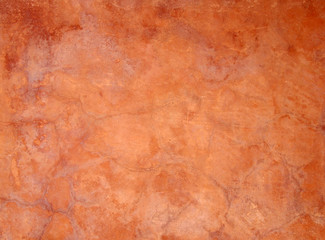 old orange brown painted faded stained cracked rough plaster wall background