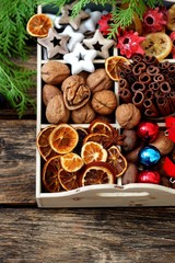 Box filled with christmas decoration and cypress branches