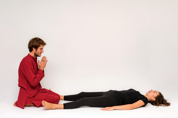 Photo of yoga poses for two stretching and relaxing on a white background.