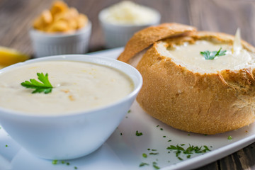 Homemade cheese cream soup, served in bread bowl