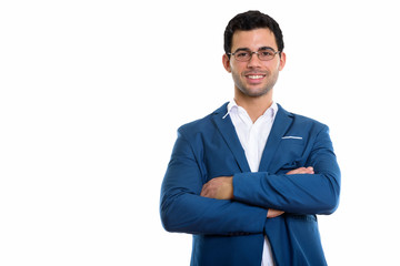 Studio shot of young happy Hispanic businessman smiling while we