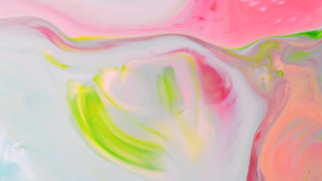 Abstract colorful paint, mixing and movement of multicolored paint in water. Multicolored acrylic paint. Fantastic surface.