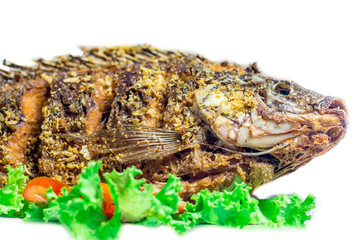 Tilapia fried with salad Thai food isolated on white