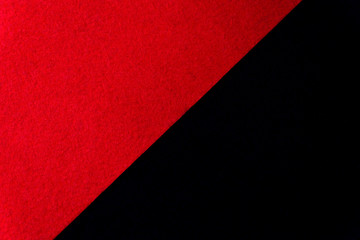 Naklejka premium A beautiful red black background divided in half.