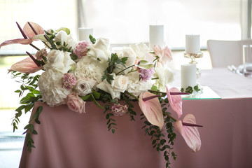 banquet pink table decorated with fresh flowers and candles. Wedding decoration concept