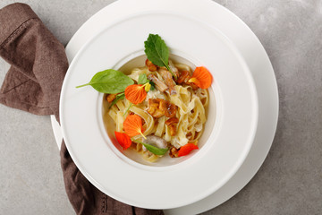 Fresh pasta with chanterelles above